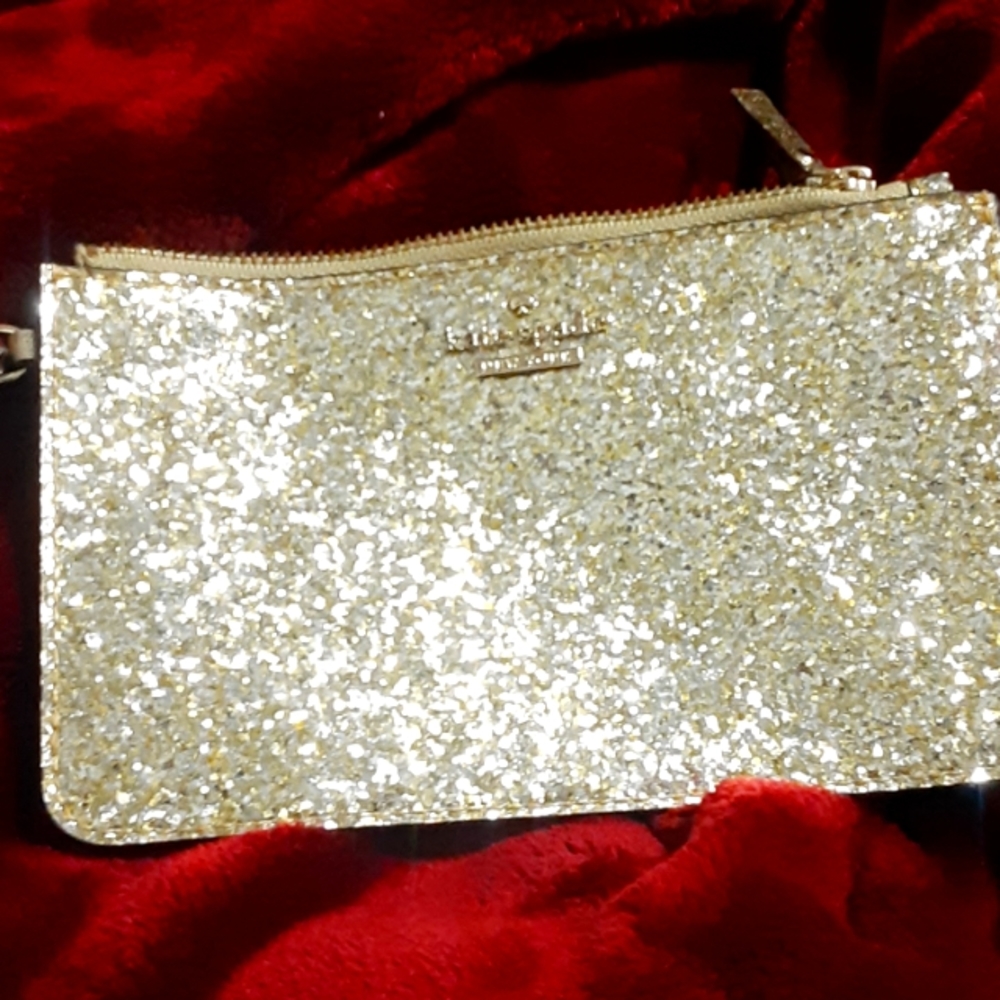 Kate Spade golden wristlet 7 X 4.5